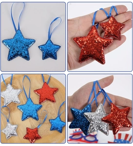 Close-up of sparkling red, blue and silver sequin star ornaments in various sizes