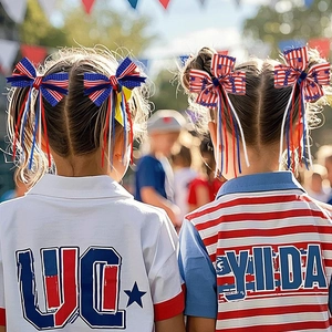 Detail of Independence Day bow hair ribbons worn by models at a patriotic party