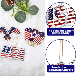 Detail of wooden 4th of July ornaments featuring eagle and USA patterns with twine ropes