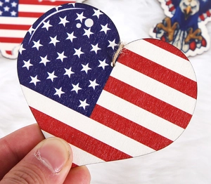 Close-up of heart-shaped wooden USA flag ornament with natural jute rope for party decor