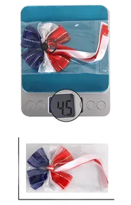 Detail view of Independence Day bow scrunchie with 16cm size measurement and 4.5g weight