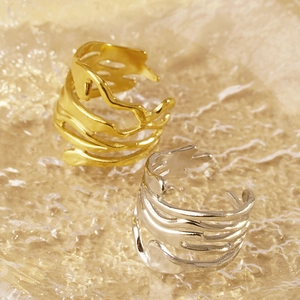 French vintage irregular hollow gold and silver adjustable open rings on glass tray