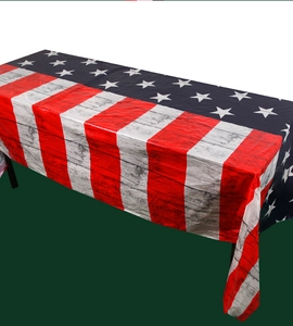 Detailed macro view of American flag tablecloth with vintage wood grain texture and star patterns