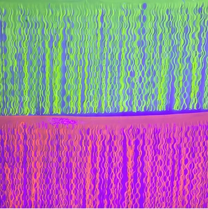 Close-up of green and orange neon fringe table skirt with wave tassels for party decor