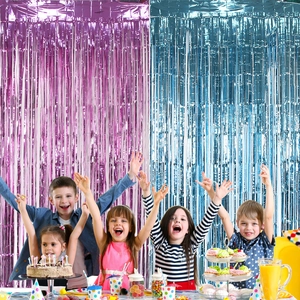Pink and blue foil fringe curtains for gender reveal party backdrop decorations
