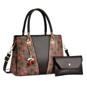 Brown monogram tote bag with cherry print and matching wallet in a two-piece set
