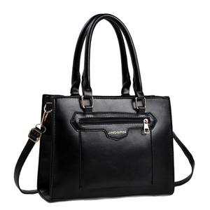 Vintage black stone-pattern tote bag with dual handles and gold-tone zipper details