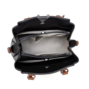 Top view of spacious interior with three compartments and textured pebbled leather surface