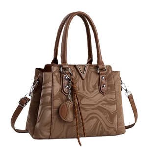Brown leather handbag with marble pattern and gold V-shaped metal logo on front