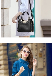 Close-up of black woven leather handbag with gold hardware and street style model view