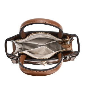 Top-down view showing partitioned interior compartments and herringbone lining of handbag