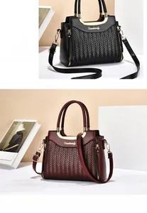 Detail showing woven V-texture and metal logo on black and burgundy leather handbags