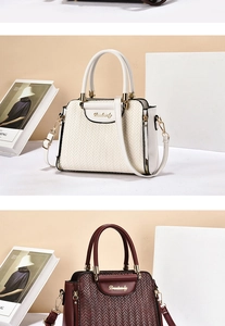 Detail of woven texture and metal hardware on elegant cream and deep red tote bags