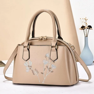 Beige floral embroidered handbag with detachable shoulder strap and trapezoid structure