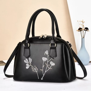 Elegant black shell bag with silver floral embroidery and gold hardware for women