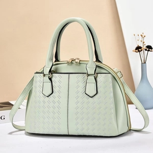 Mint green textured tote bag with top handles and detachable strap for daily commute