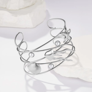 Bracciale rigido argento multistrato stile oceano con stella marina, conchiglie e perle