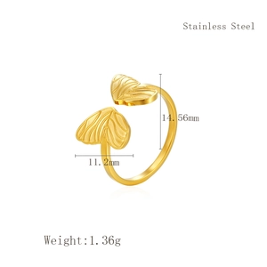 Macro detail of gold adjustable stainless steel ring with butterfly wing design