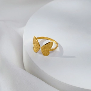Elegant gold butterfly wing stainless steel open ring with textured satin finish
