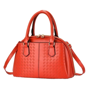 Red textured boston handbag with woven pattern, dual handles and gold-tone hardware