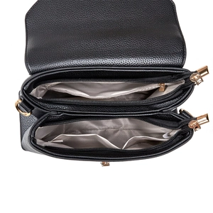 Interior view of black pebbled leather shoulder bag with dual zipper pockets and grey lining