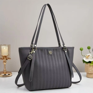 Retro dark grey embossed tote bag with gold emblem and slender handles for women