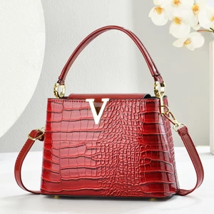 Elegant red crocodile pattern handbag with gold V-buckle and versatile shoulder strap