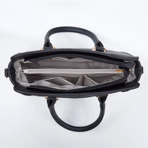 Top view of black tote bag interior showing grey geometric lining and zipper pockets