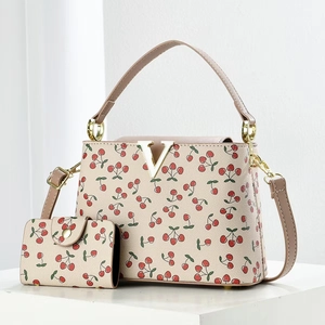 Luxury cherry print bucket bag and matching coin purse set in white lychee leather