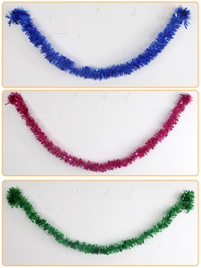 Detailed view of 2m thick blue, magenta, and green tinsel garlands for festive party decoration