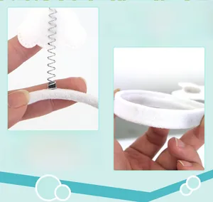 Detail of highly elastic white plush headband with cute cloud spring attachments