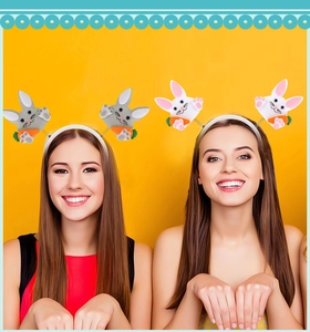 Detailed view of plush Easter bunny ear headbands with carrot motifs on kids
