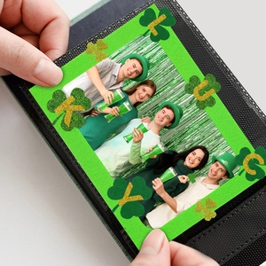 Lucky clover photo frame for St. Patrick's Day celebration with green glitter clover accents