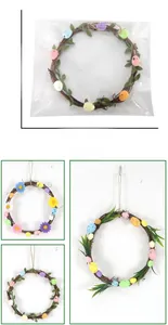 Easter wreath with colorful eggs and flowers showing dimensions of 20cm by 16.5cm