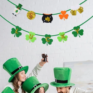 St. Patrick's Day Lucky clover banner set with glitter gold letters on white brick wall