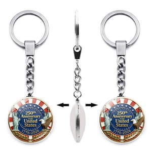 Three-angle view of silver alloy keychain for US 250th Anniversary with glass dome pendant