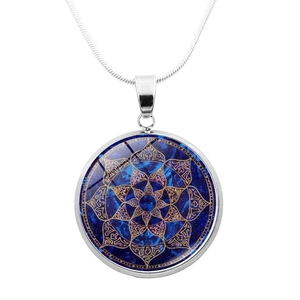 Close-up of a silver mandala pendant necklace with blue nebula background and snake chain