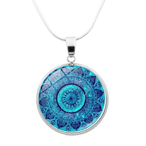 Vintage silver mandala pendant necklace with blue geometric pattern on a snake chain