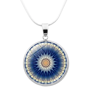 Close-up of circular yoga mandala flower pendant with a sleek silver snake chain