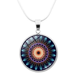 Detailed close-up of mandala pendant necklace with colorful glass cabochon on silver chain