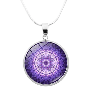 Macro detail of silver snake chain and purple mandala glass pendant jewelry
