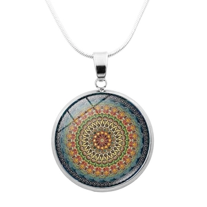 Close-up of a round mandala flower pendant on a silver snake chain necklace