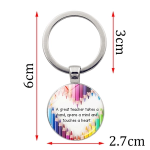 Silver teacher appreciation keychain with heart pencil design and size dimensions