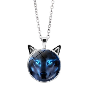 Detail of silver necklace featuring a cat-ear pendant with a blue-eyed wolf art glass cabochon