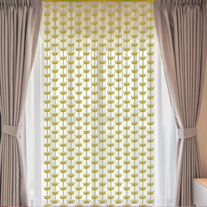 Detail of laser golden crown tinsel curtain for party backdrops and birthday decorations