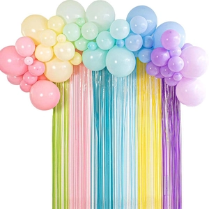 Pastel balloon arch set with colorful fringe curtain backdrop for festive party decoration