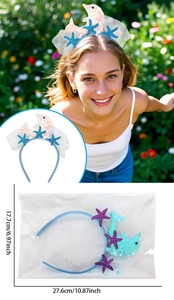 Detail van de dolfijn hoofdband met pailletten, 27,6 cm hoogte en de verpakking