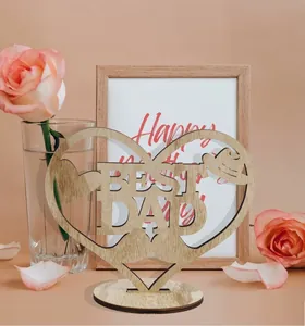Macro detail of wooden heart ornament with BEST DAD hollow letters for Father's Day gift