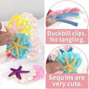 Cute mermaid shell hair clip with sequins and starfish on a soft duckbill clip