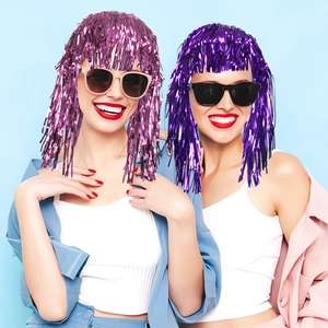 Metallic tinsel wigs in magenta and purple colors for festive party costume decorations